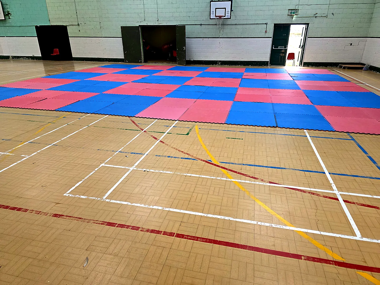 Leinster TaeKwon Do training hall in Arklow with red and blue mats laid out for class